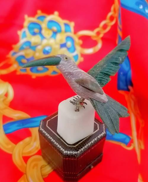 A stunning vintage Gem stone humming bird
