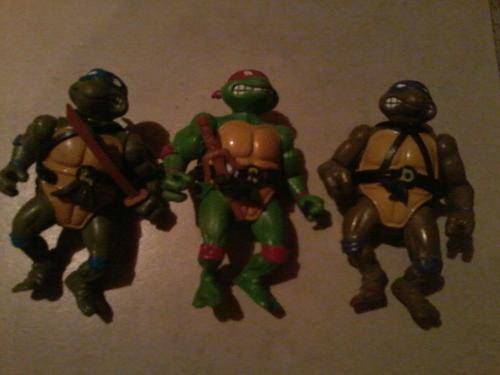 3 teenage mutant ninja turtles about 20 years old good condition for the nostalgic person