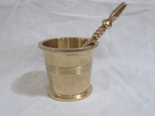 Brass pestle and mortar.