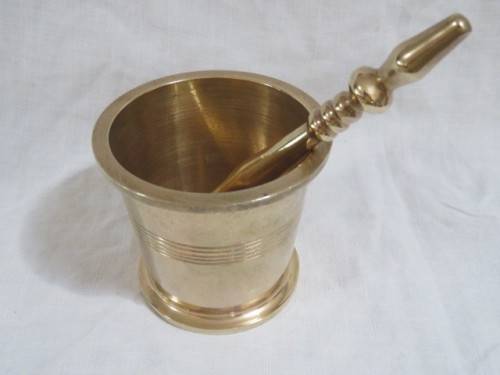 Brass pestle and mortar.