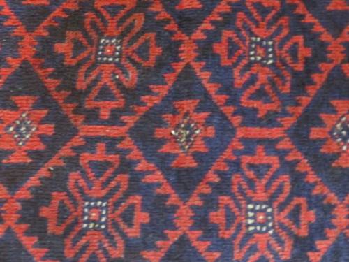 A Persian hand knotted Beluchi rug