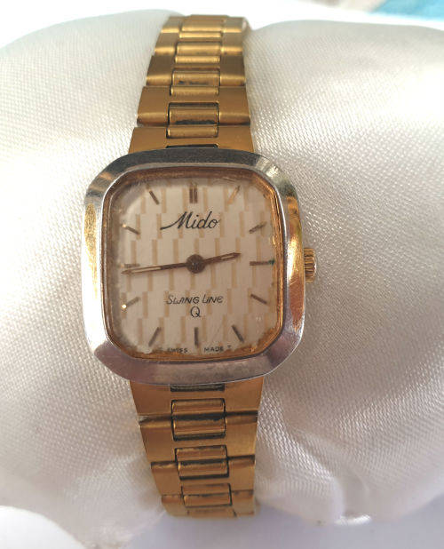 Vintage Swiss Made 1980`S MIDO Swing line Q Ladies Quartz watch  with Mido Strap-working