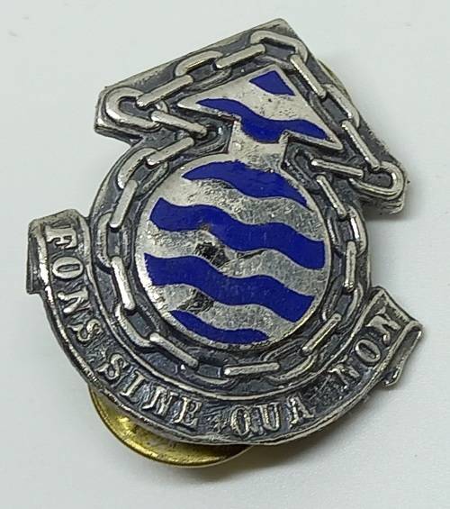 Vintage SA ORDINANCE SERVICES CORPS CAP BADGE  "FONS SINE QUA NON" ( THE INDISPENSIBLE FOUNTAIN}