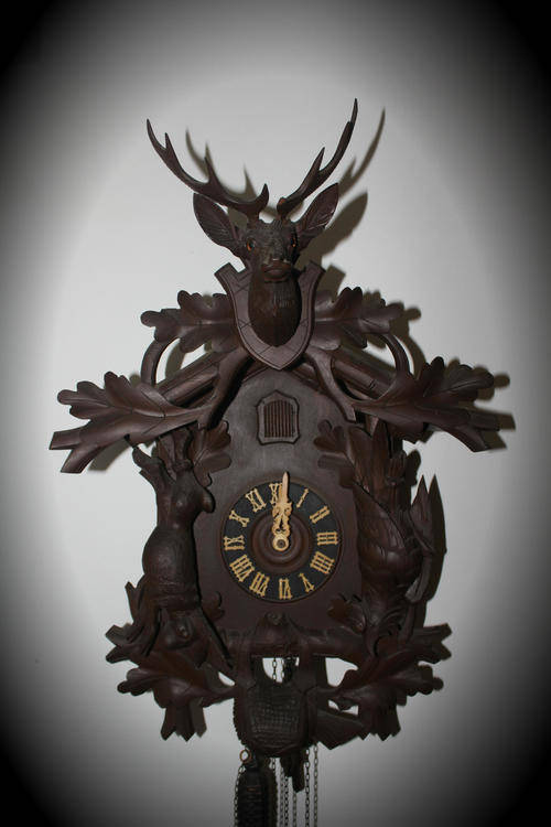 A Large Vintage BLACK FOREST Cuckoo Clock working ..only problem the  birds beak is broken