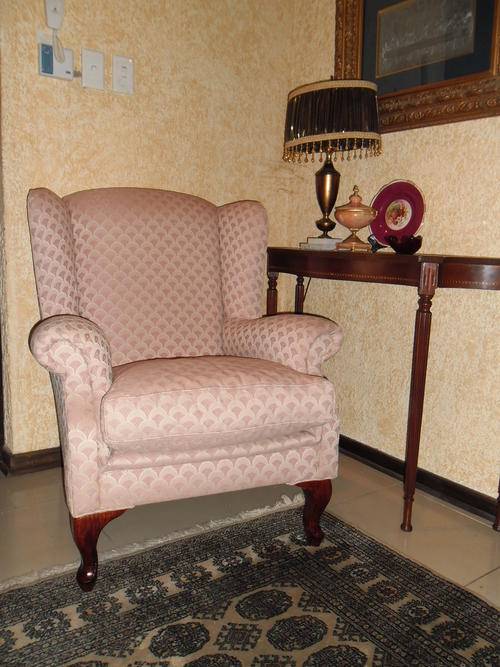 A  Queen Anne wing-back chair