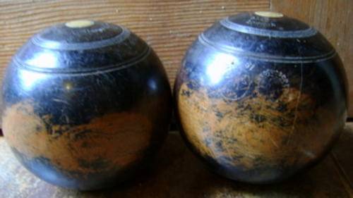 Pair of wooden bowling balls circa l927 Taylor Rolph Co Ltd Made in London Inset made of Brass