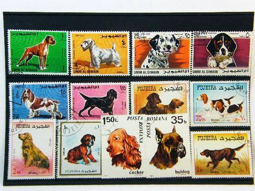 Collection of 13 thematic dog stamps - as per photo