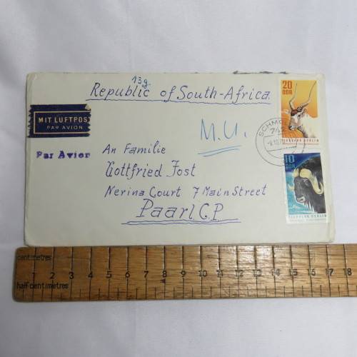 Airmail cover from Schmolln, DDR to Paarl, South Africa with airmail tag and Par Avion ink cancel