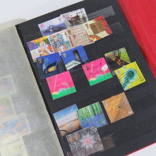 Lot of over 230 British and other stamps in album