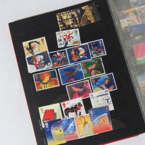 Lot of over 230 British and other stamps in album