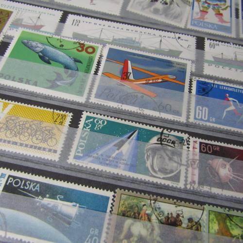 12 Page stamp album with over 500 world stamps