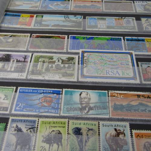 12 Page stamp album with over 500 world stamps
