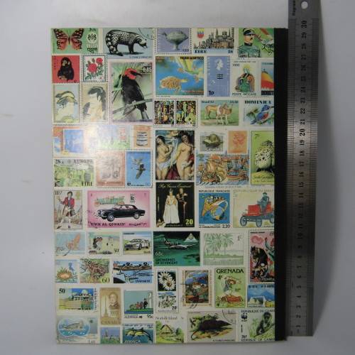 12 Page stamp album with over 500 world stamps