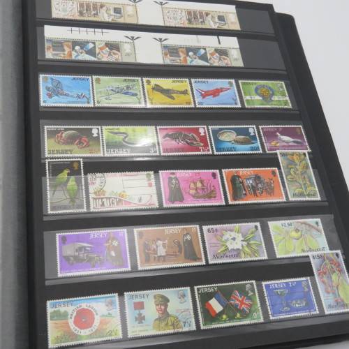 Stamp album with over 1070 stamps - England Jersey Isle of man Gibraltar mint and used