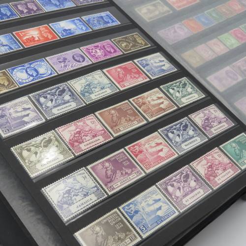 Stamp album with over 1070 stamps - England Jersey Isle of man Gibraltar mint and used