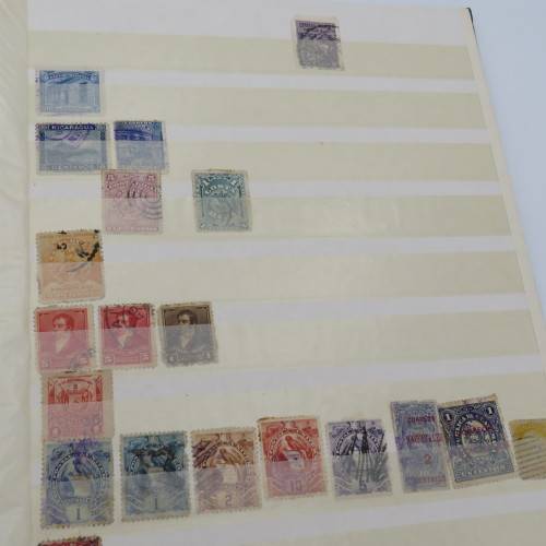 16 Page stamp album with over 700 old stamps - Some better stuff - Have a look at the photos