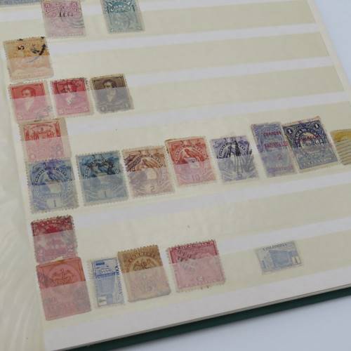 16 Page stamp album with over 700 old stamps - Some better stuff - Have a look at the photos