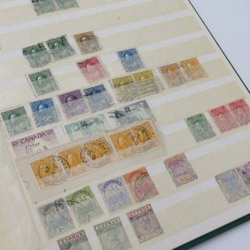 16 Page stamp album with over 700 old stamps - Some better stuff - Have a look at the photos