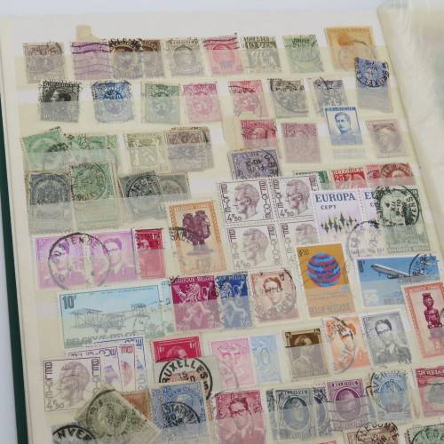 16 Page stamp album with over 700 old stamps - Some better stuff - Have a look at the photos