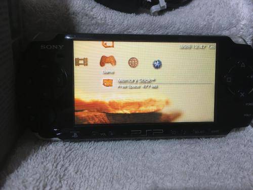PSP 3004, 512MB Memory Card Charger, 5 Games + 4 UMD Music videos