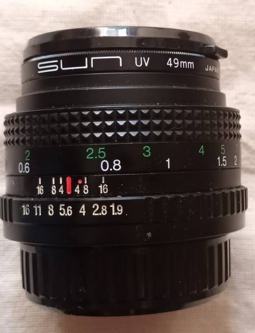 Auto Chinon 50mm Lens (Made in Japan) with Sun UV 49mm Skylight - Caps both ends