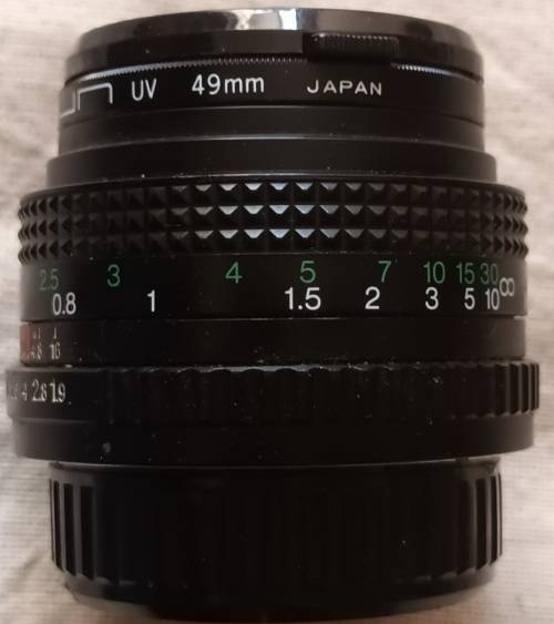 Auto Chinon 50mm Lens (Made in Japan) with Sun UV 49mm Skylight - Caps both ends