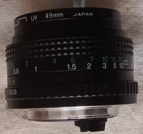 Auto Chinon 50mm Lens (Made in Japan) with Sun UV 49mm Skylight - Caps both ends