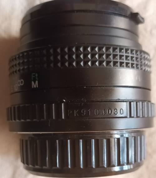 Auto Chinon 50mm Lens (Made in Japan) with Sun UV 49mm Skylight - Caps both ends