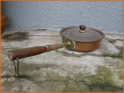 Vintage copper and brass pot/pan with wooden handle.