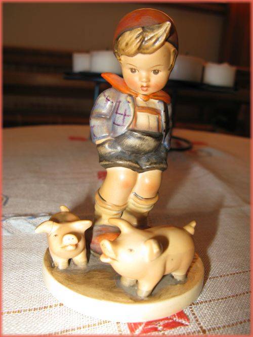 Vintage Goebel Hummel Boy with two pigs. Mended ear.