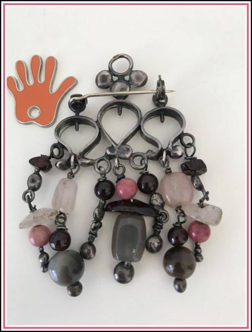 Lovely brooch with smokey semi-precious stones dangling.
