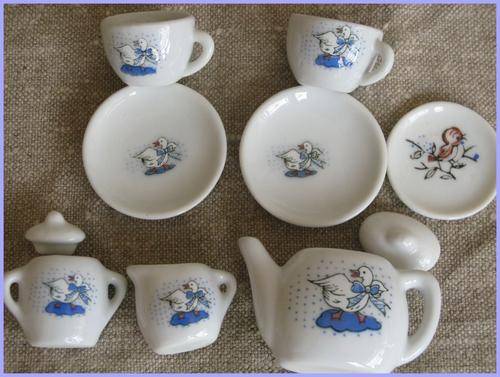 Doll's tiny porcelain tea set. Mother Goose.