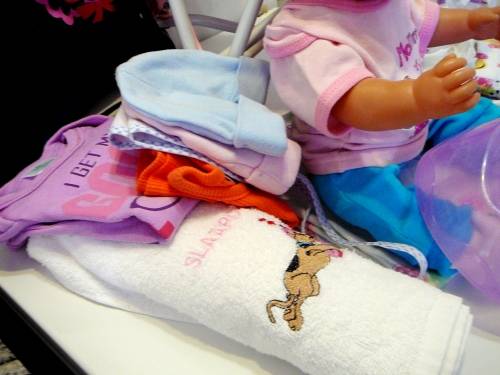 ZAPF Creations - Baby Born Doll in Stroller with A Bag of Clothing and a Potty