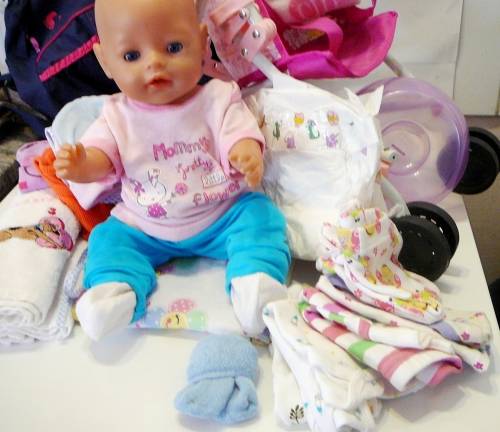 ZAPF Creations - Baby Born Doll in Stroller with A Bag of Clothing and a Potty