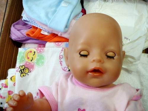 ZAPF Creations - Baby Born Doll in Stroller with A Bag of Clothing and a Potty
