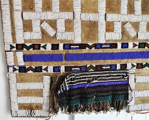 A Hand Made Glass Bead and Leather African Wall Hanging