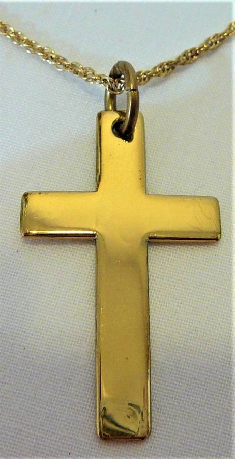 A Gold Coloured Cross on a Chain