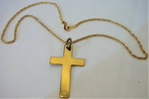 A Gold Coloured Cross on a Chain
