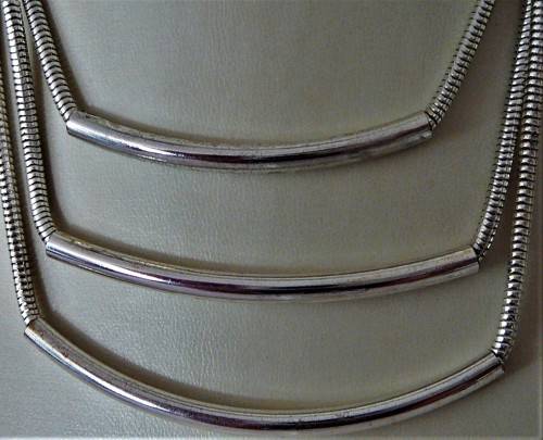 An Elegant Three Chain Silver Coloured Necklace