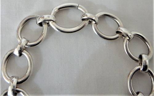 A Silver Bracelet of Hollow Silver Rings with an Unusual Hinged Ring Clasp