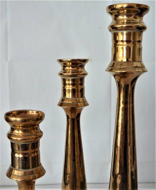 A Solid Brass Triple Candle Holder on a Round Base