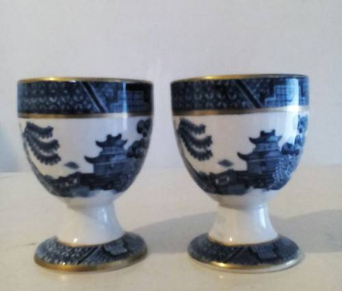 Pair Booth's ceramic Willow pattern egg cups. Can combine postage.