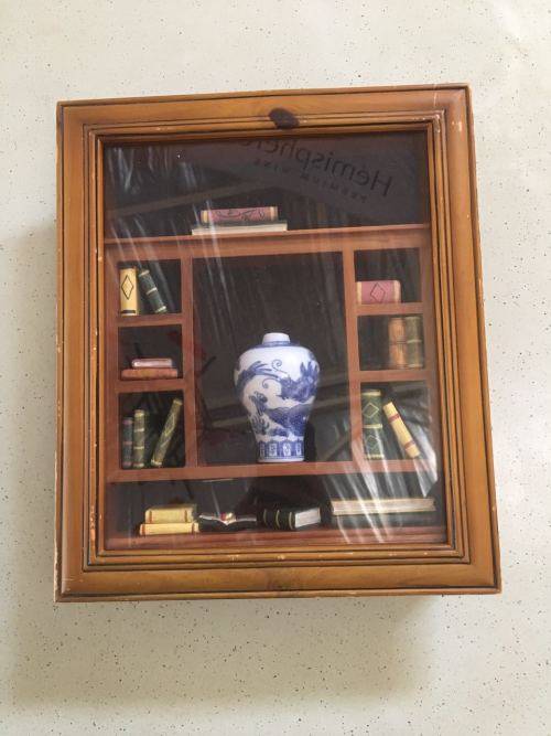 A AMAZING FRAMED BOXED SHELF WITH BOOKS AND PORCELAIN VASE