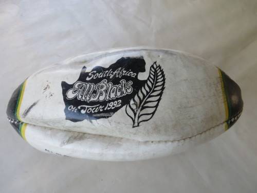 SMALL DEFLATED RUGBY BALL - 240 MM WIDE - SOUTH AFRICA / ALL BLACKS ON TOUR 1992 - AS PER SCAN