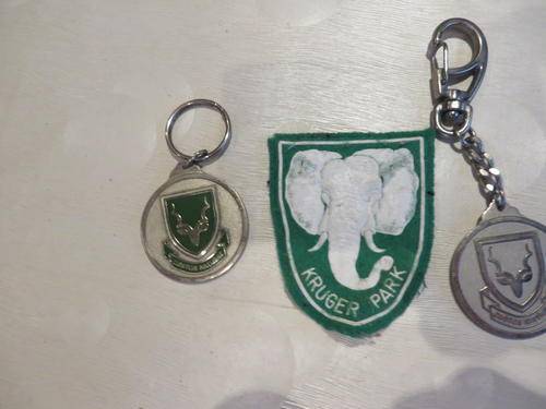 KRUGER PARK CLOTH BADGE AND TWO NATIONAL PARKS BOARD KEY HANGERS - AS PER SCAN