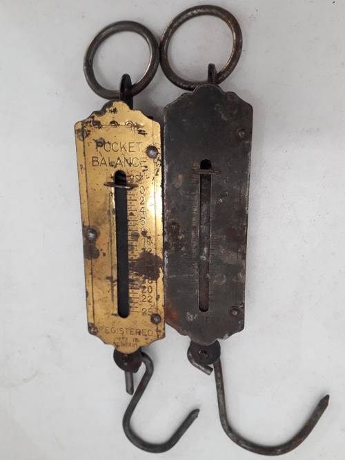Two spring balance scales