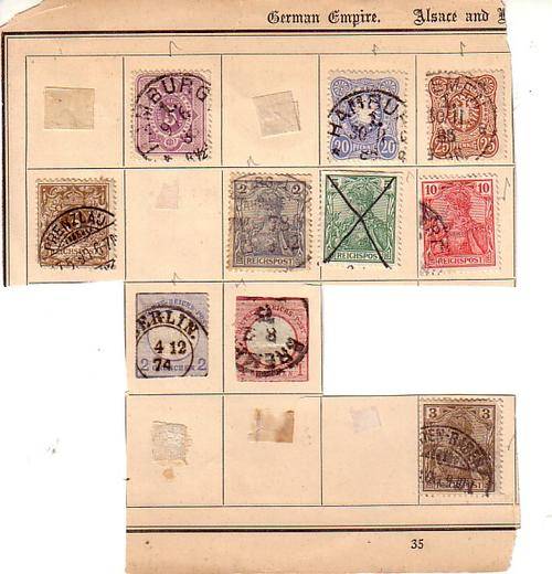 A few very old German stamps on piece of album page