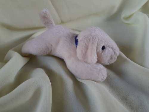 Plush Puppy Lying on Stomach