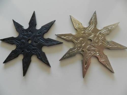 Ninja stars set of two.  Circa 1980s. Eight point Ninja throwing star in solid steel.
