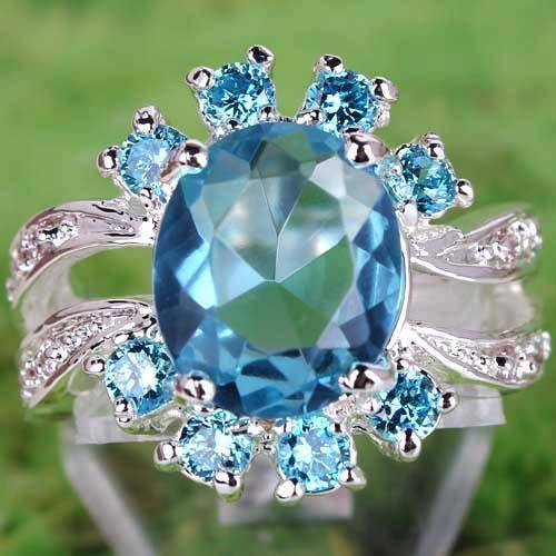 BREATHTAKING BLUE TOPAZ & WHITE TOPAZ CZ RING IN SILVER